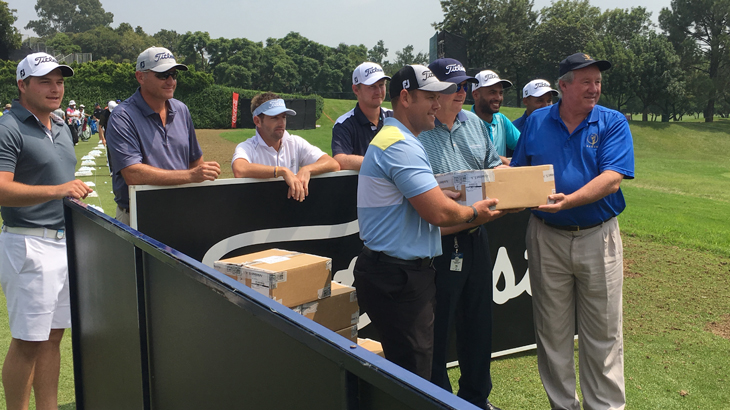 Leonard Loxton handing over some golf balls to a...