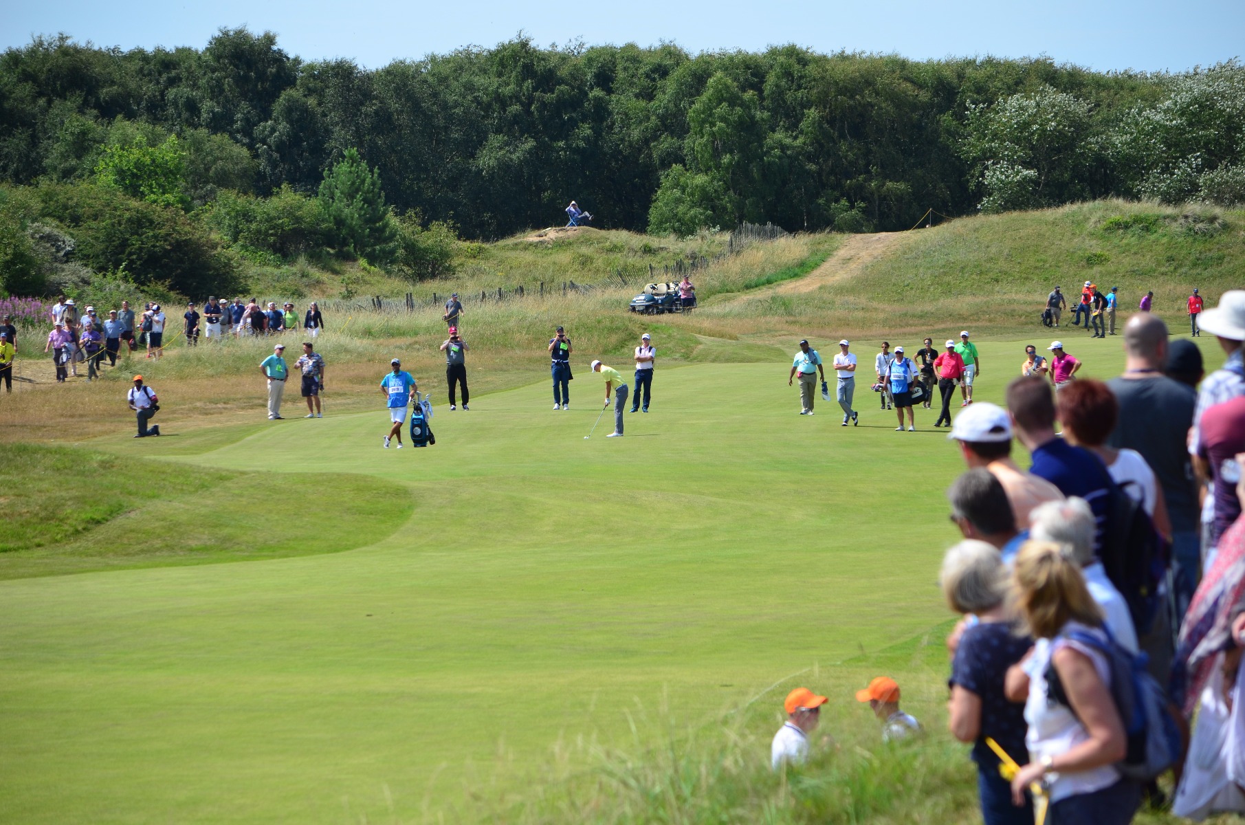 Watching on as the main pairing walk up the...